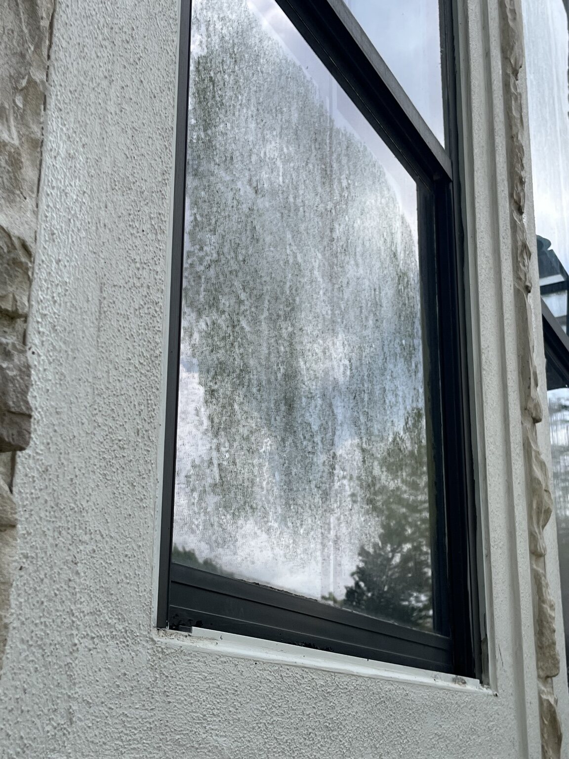 Before — Window glass before and after cleaning by Bellaire Pro Wash
